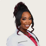 Headshot of Miariesha Brown MSN-FNP, Her Fantasy Box medical team member, in white coat with stethoscope.