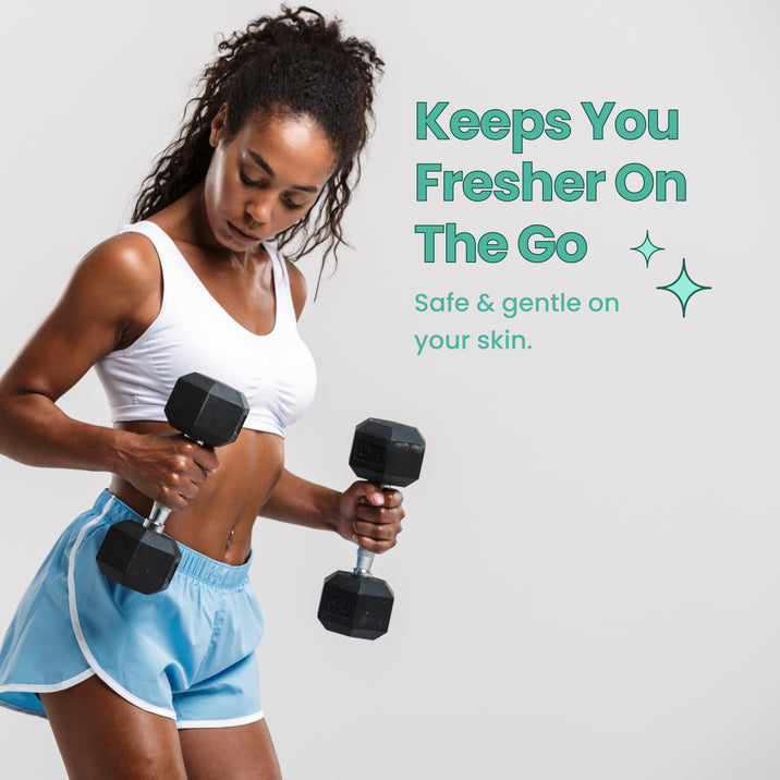 Keeps You Fresher On The Go. Safe & gentle on your skin. Woman lifting dumbbells wearing white sports top and blue shorts.