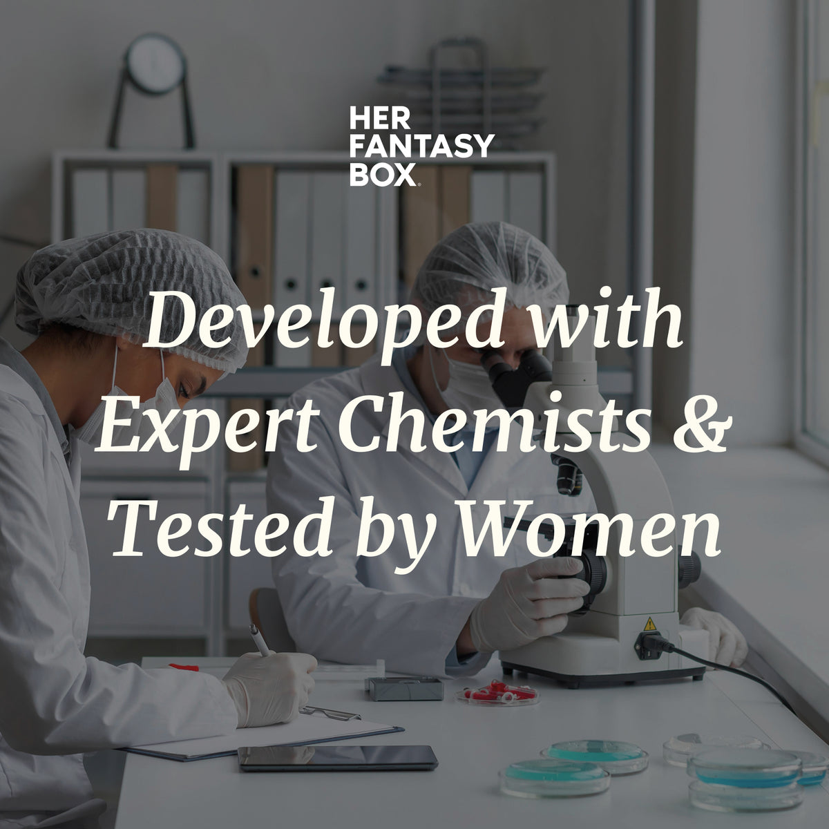 Her Fantasy Box: Developed with Expert Chemists & Tested by Women; two lab scientists in white coats working with microscope and samples