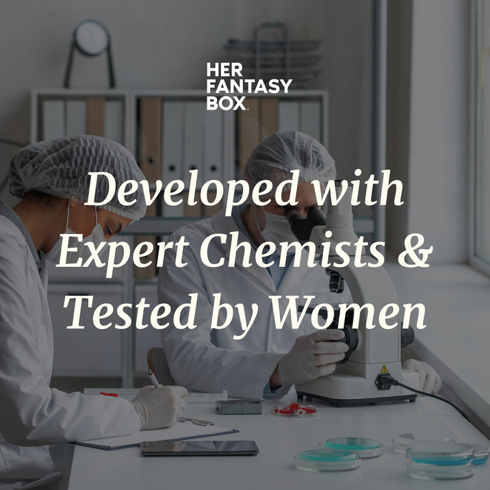 Her Fantasy Box: Developed with Expert Chemists & Tested by Women; two lab scientists in white coats working with microscope and samples