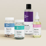 Her Fantasy Box kit featuring Slippery Box, Body Magic, Refresh pH-balanced cleanser, and Renew Her oil on neutral background