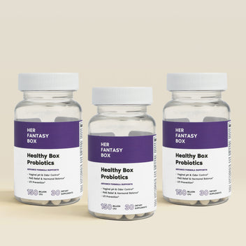Three bottles of Her Fantasy Box Healthy Box Probiotics on a beige background