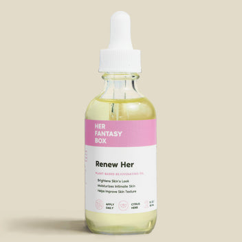 Bottle of 'Renew Her' skincare oil with a dropper on a beige background