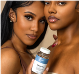 Her Fantasy Box Slippery Box natural moisture supplement held by two women in a close portrait