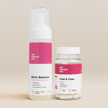 Her Fantasy Box Fresh & Clean Kit — Boric Balance pH foam wash and Fresh & Clean boric acid suppositories for feminine balance on a beige background