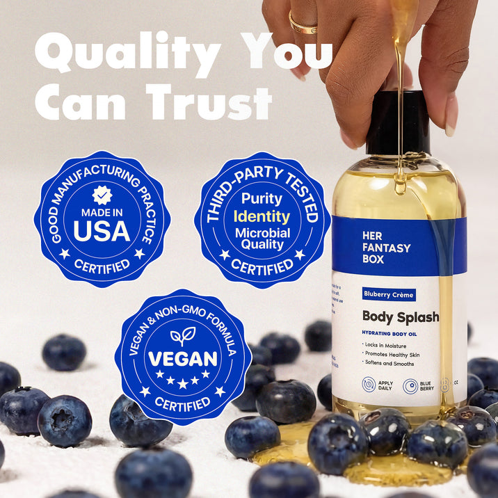 Quality You Can Trust. Her Fantasy Box Bluberry Crème Body Splash Hydrating Body Oil – Locks In Moisture, Promotes Healthy Skin, Softens and Smooths. Apply Daily, Blueberry, 8 fl oz. Three badges: Good Manufacturing Practice – Made in USA – Certified. Third-Party Tested – Purity, Identity, Microbial Quality – Certified. Vegan & Non-GMO Formula – Vegan – Certified. Hand dropping oil into bottle, fresh blueberries surrounding.