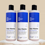 Three bottles of Her Fantasy Box Body Vitamins Blueberry Crème multi-vitamin body wash 16 fl oz displayed together on neutral background