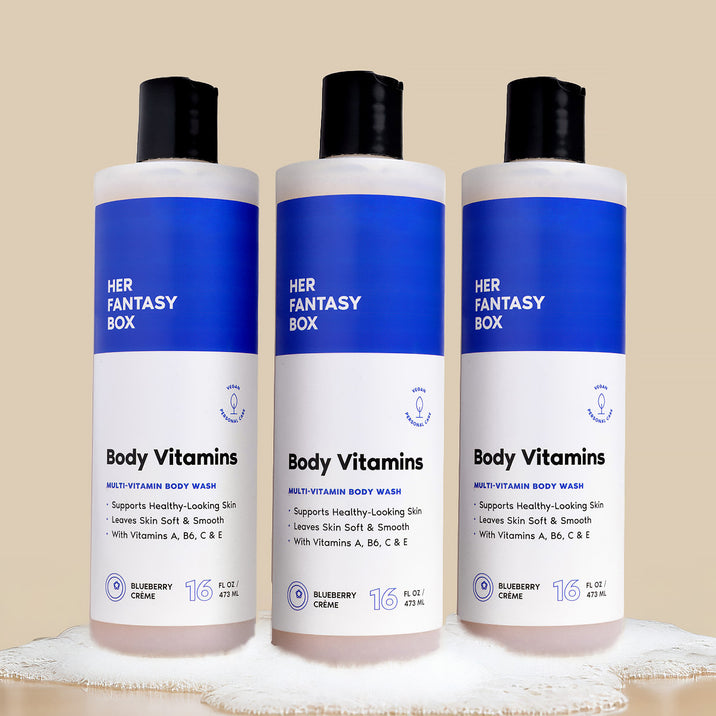 Three bottles of Her Fantasy Box Body Vitamins Blueberry Crème multi-vitamin body wash 16 fl oz displayed together on neutral background