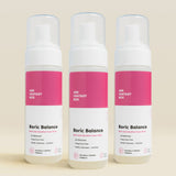 Three bottles of Her Fantasy Box Boric Balance boric acid sensitive foam wash displayed together on neutral beige background, pH-balanced fragrance-free cleanser for gentle intimate care