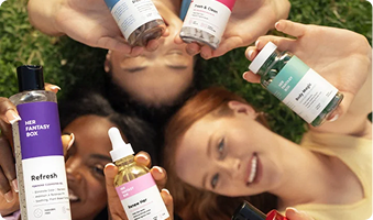 People holding skincare products with a focus on natural and organic elements.