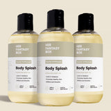 Three bottles of Her Fantasy Box Santal Driftwood Body Splash hydrating body oil displayed together on neutral background