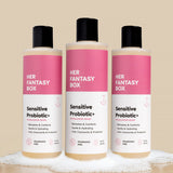 Three bottles of 'Her Fantasy Box' sensitive probiotic products on a beige background