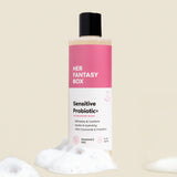 Her Fantasy Box Sensitive Probiotic+ wash bottle with pink label on a beige background