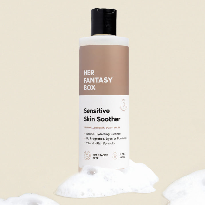 Single bottle of Her Fantasy Box Sensitive Skin Soother hypoallergenic body wash with lather on neutral background