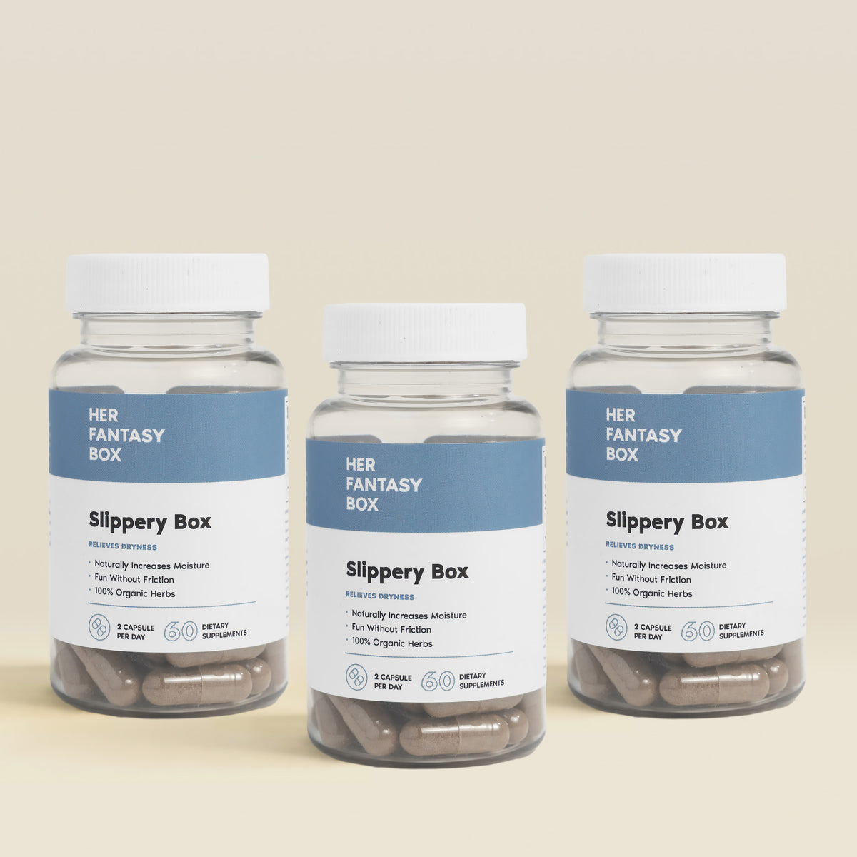Three bottles of 'Her Fantasy Box Slippery Box' on a beige background