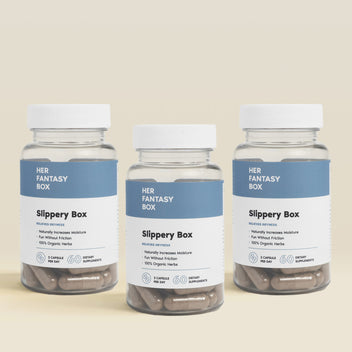 Three bottles of 'Her Fantasy Box Slippery Box' on a beige background