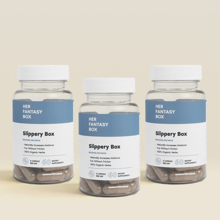 Three bottles of 'Her Fantasy Box Slippery Box' on a beige background