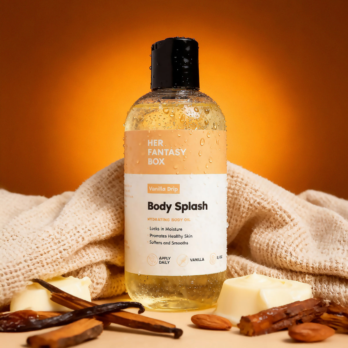 Her Fantasy Box Vanilla Drip Body Splash hydrating body oil styled with vanilla beans, cinnamon, almonds, and butter.